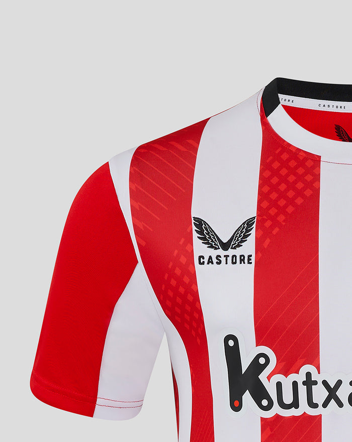 Close-up of red and white striped jersey with Castore logo on the chest