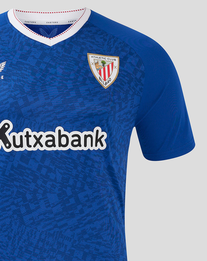 Close-up of blue away shirt showing Athletic Club Bilbao crest on the chest and the Kutxabank sponsor across the front.