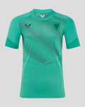 Front view of teal MEN'S 24/25 Elite Players Training Short Sleeve Drill Tee with dotted chest pattern and team crest.