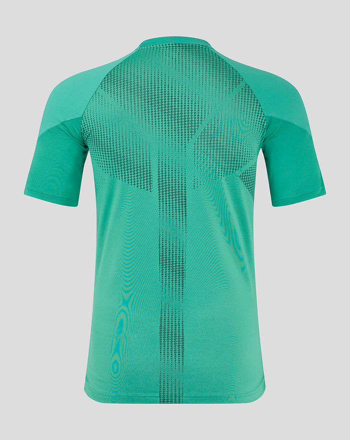 Back view of teal elite training tee with dotted panel across upper back and vertical central pattern.