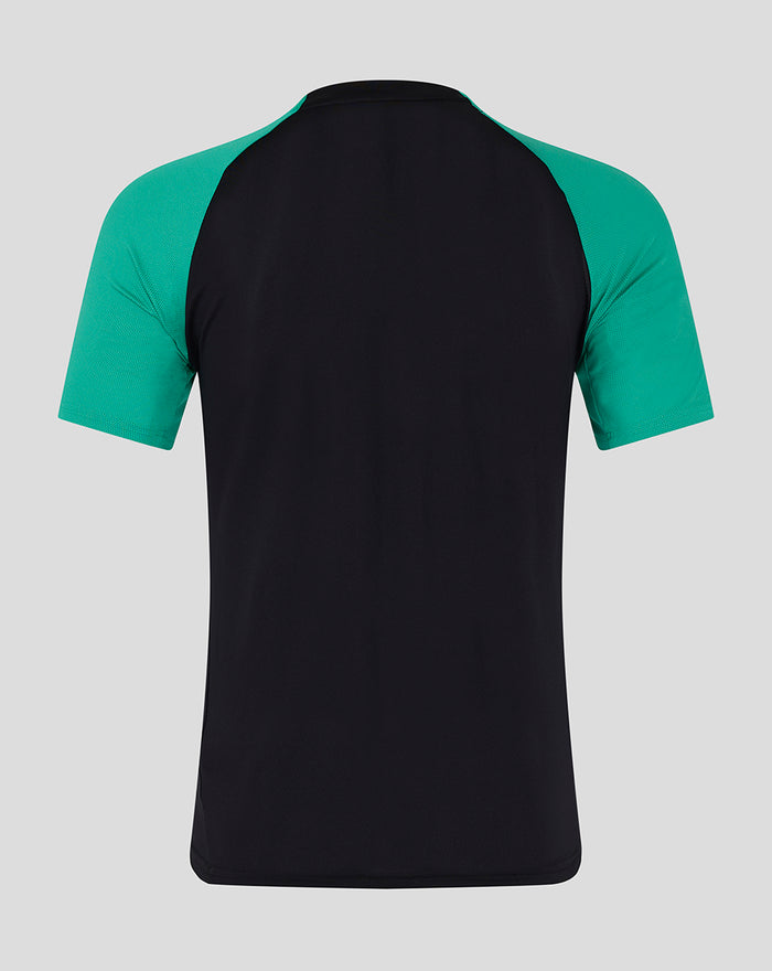Back view of junior pro coaches training tee with teal sleeves and black body