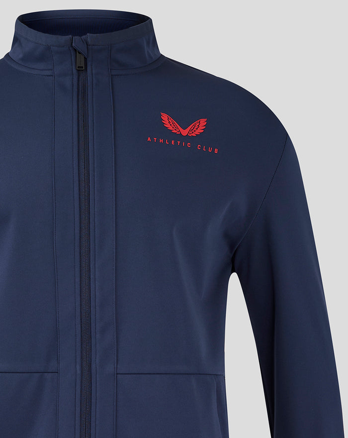 Navy junior travel jacket close-up with red Athletic Club logo on the chest and front zip