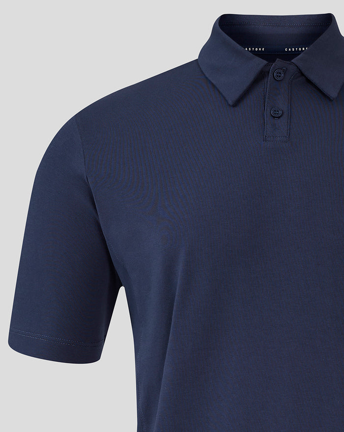 Front view of navy Travel Polo showing folded collar, two-button placket and red Athletic Club logo on the left chest