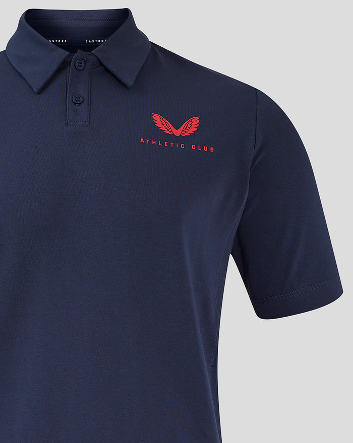 Close-up of navy polo with red Athletic Club logo embroidered on the left chest