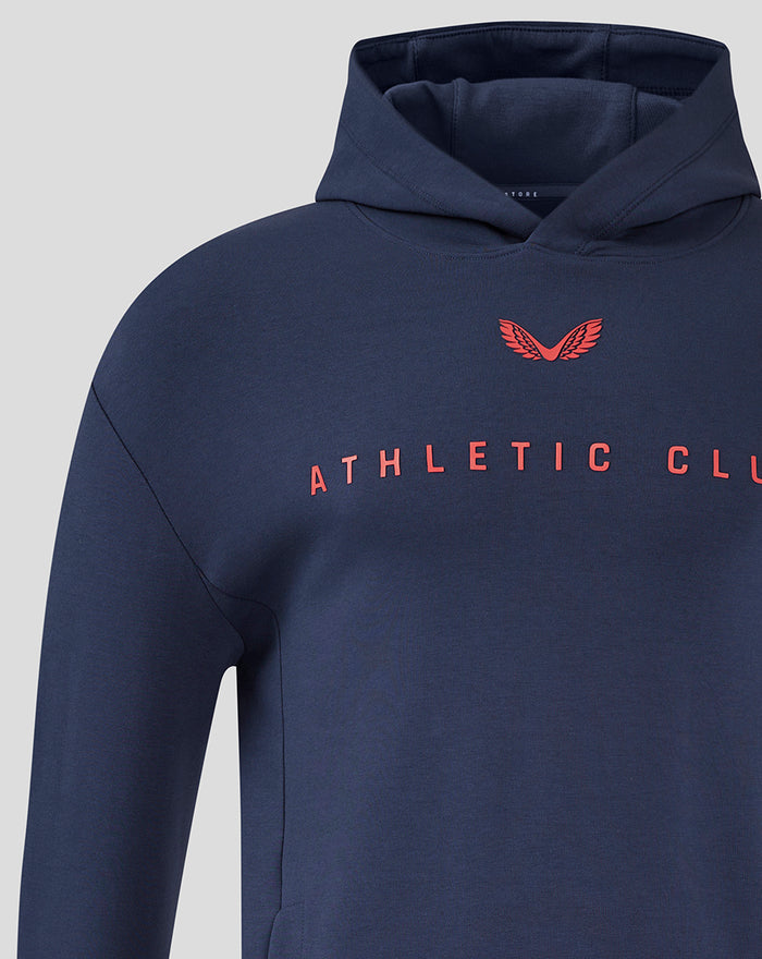 Navy junior Travel Logo Hoodie chest view with red crest and Athletic Club lettering.