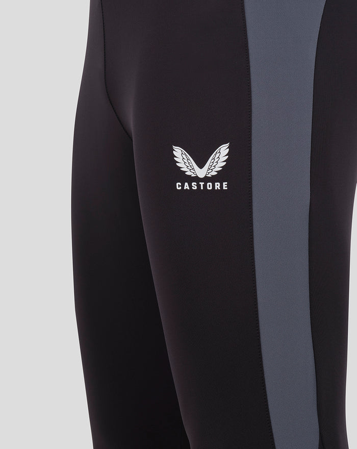 Close up of black training pants showing gray side panel and Castore wing logo