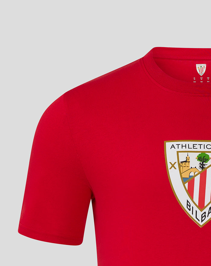 Close up of red MEN'S CORE CREST TEE showing chest crest and partial neckline.