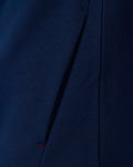 Close up of navy fleece fabric and seam detail on the athletic club full zip jacket