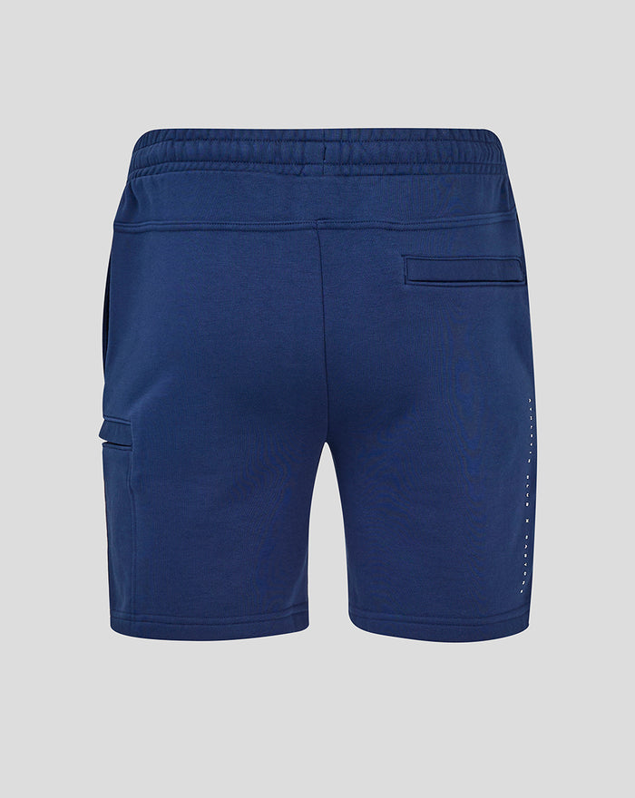 Back view of blue athletic shorts with a rear welt pocket and dotted side detail.