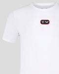 White T shirt with a red bordered chest patch logo on the left chest.