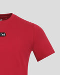 Partial front view of a red Athletic Club cotton tee with a small crest patch on the chest.