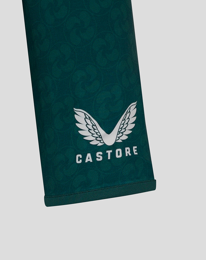 Pant leg detail in dark green with white Castore wing logo near the cuff
