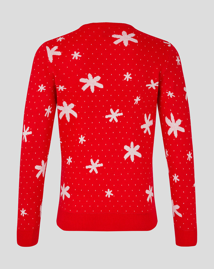 Back view of red Christmas jumper covered in white snowflakes on a red knit fabric