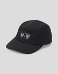 Close up of black Club Cap Dual Castore front patches featuring winged emblem and shield crest