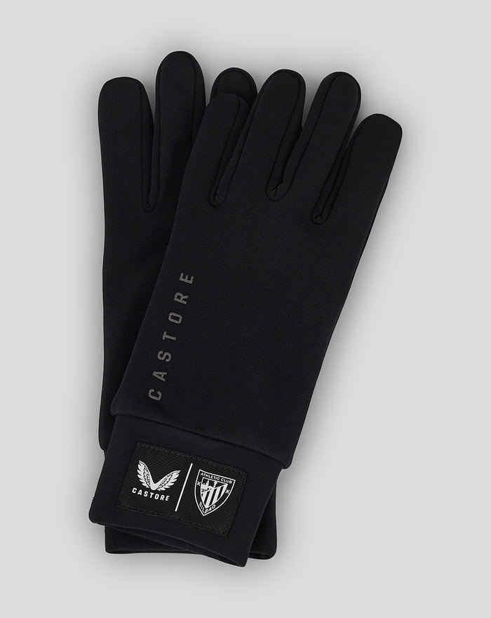 Black gloves with Castore branding and shield crest on the cuff.