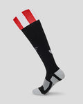Black knee-high sock with red white foldover cuff and grey heel and toe featuring athletic club branding.