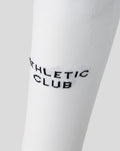 White athletic club home footless sock close up with textured knit and black branding