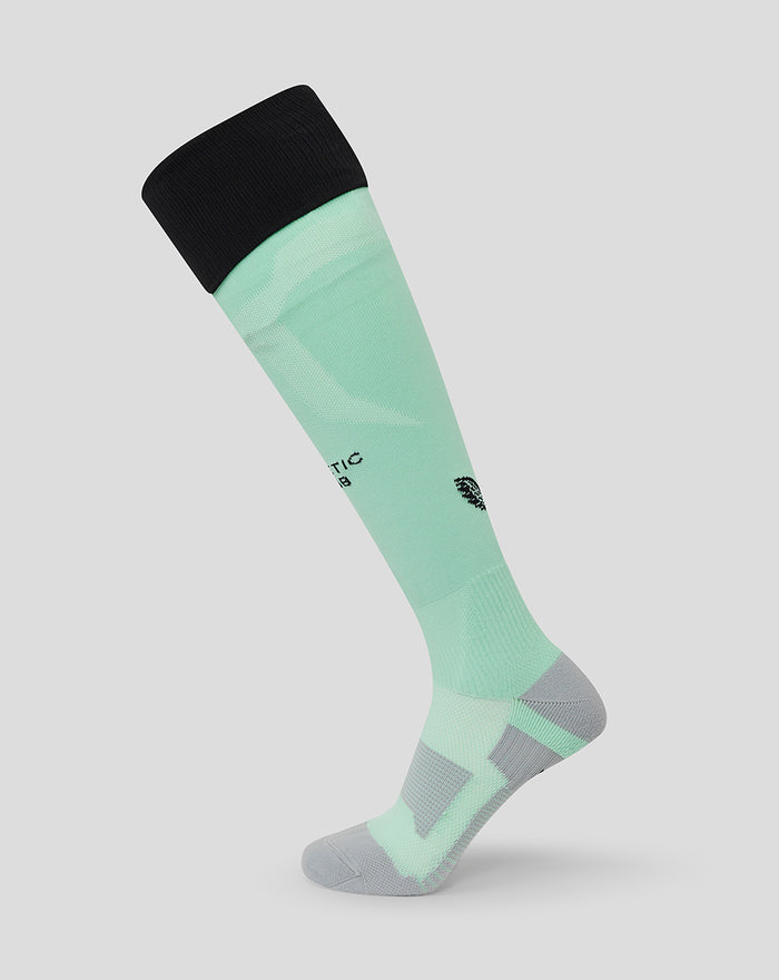 Mint green knee high sock with a black top cuff and grey heel and toe