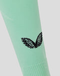 Mint green Athletic Club third sock close up with black wing logo on calf area