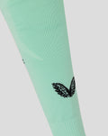 Mint green Athletic Club third footless sock close up showing shin branding.