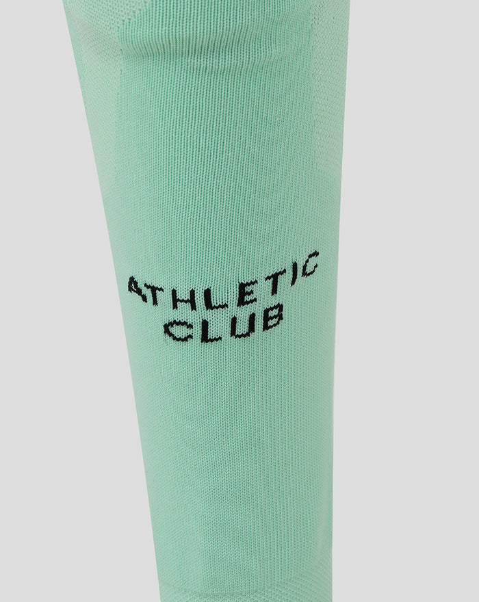 Mint green Athletic Club third footless sock close up with calf branding.