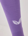 Purple Athletic Club third goalkeeper sock on leg with white branding on the shin and knit texture