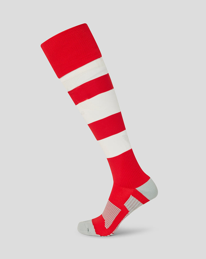 Knee-high athletic sock in red and white horizontal stripes with a red cuff