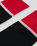 Red and black full foot sock with white cuff trim from the Athletic Club replica kit