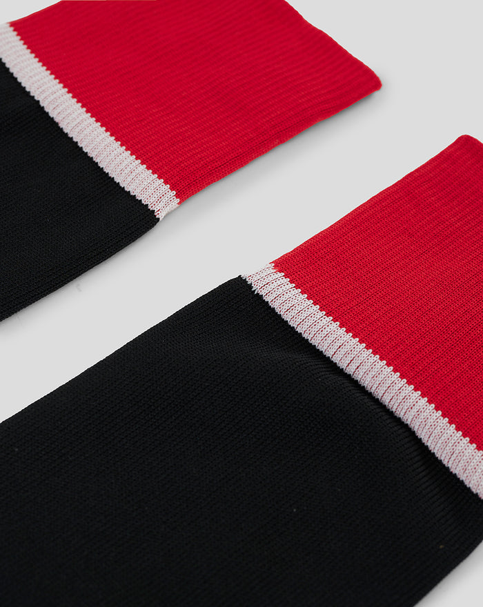 Red and black full foot sock with white cuff trim from the Athletic Club replica kit