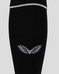 Close up of black home goalkeeper footless sock knit fabric with a white hoop at the top and an embroidered club crest near the ankle