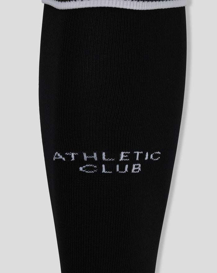 Close up of black Athletic Club home GK footless sock with white branding along the leg
